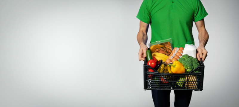 a man holding grocery basket