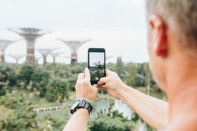 A man taking photo of Gardens by the Bay in Singapore