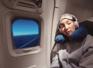 Asian,Girl,Sleeping,In,Her,Seat,On,The,Plane,Near