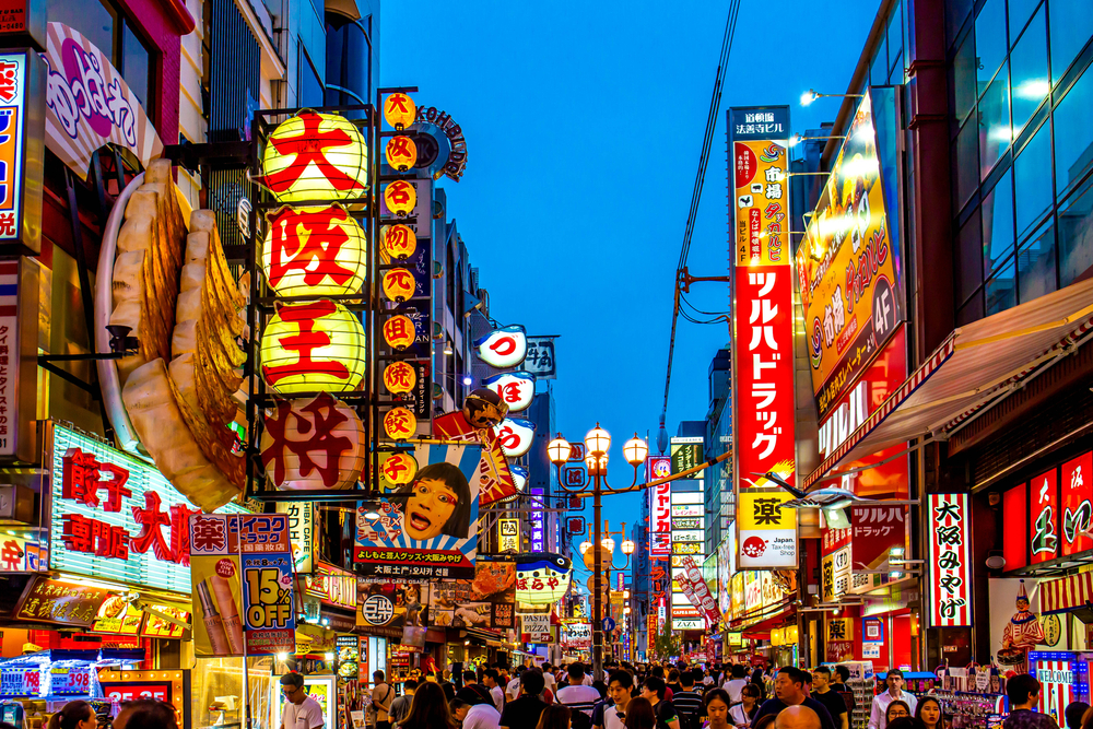 Night shopping street with twilight sky at Dotonbori, famous destination for tourists in Shinsaibashi, Osaka City.