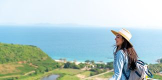 Asian,Woman,With,Backpack,Solo,Travel,On,Tropical,Island,Mountain