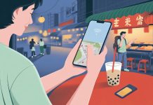 Traveller using smartphone with Taiwan SIM card for navigation in Taipei